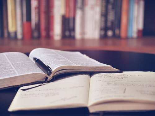 open books on a library table