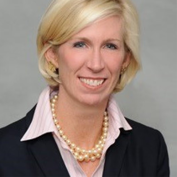 Allison Kropp smiling, wearing business attire