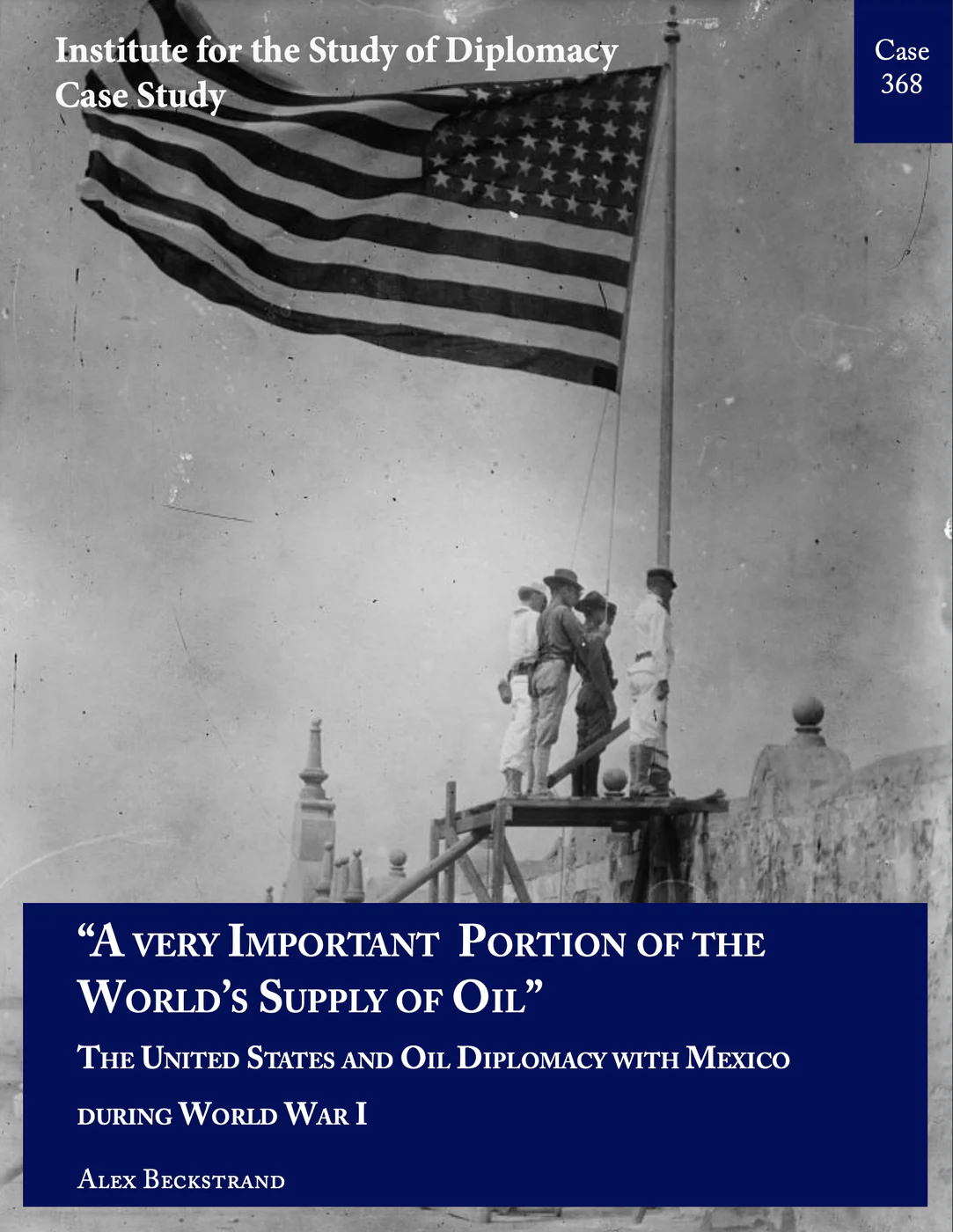 A photo of several soldiers standing beneath the U.S. flag.
