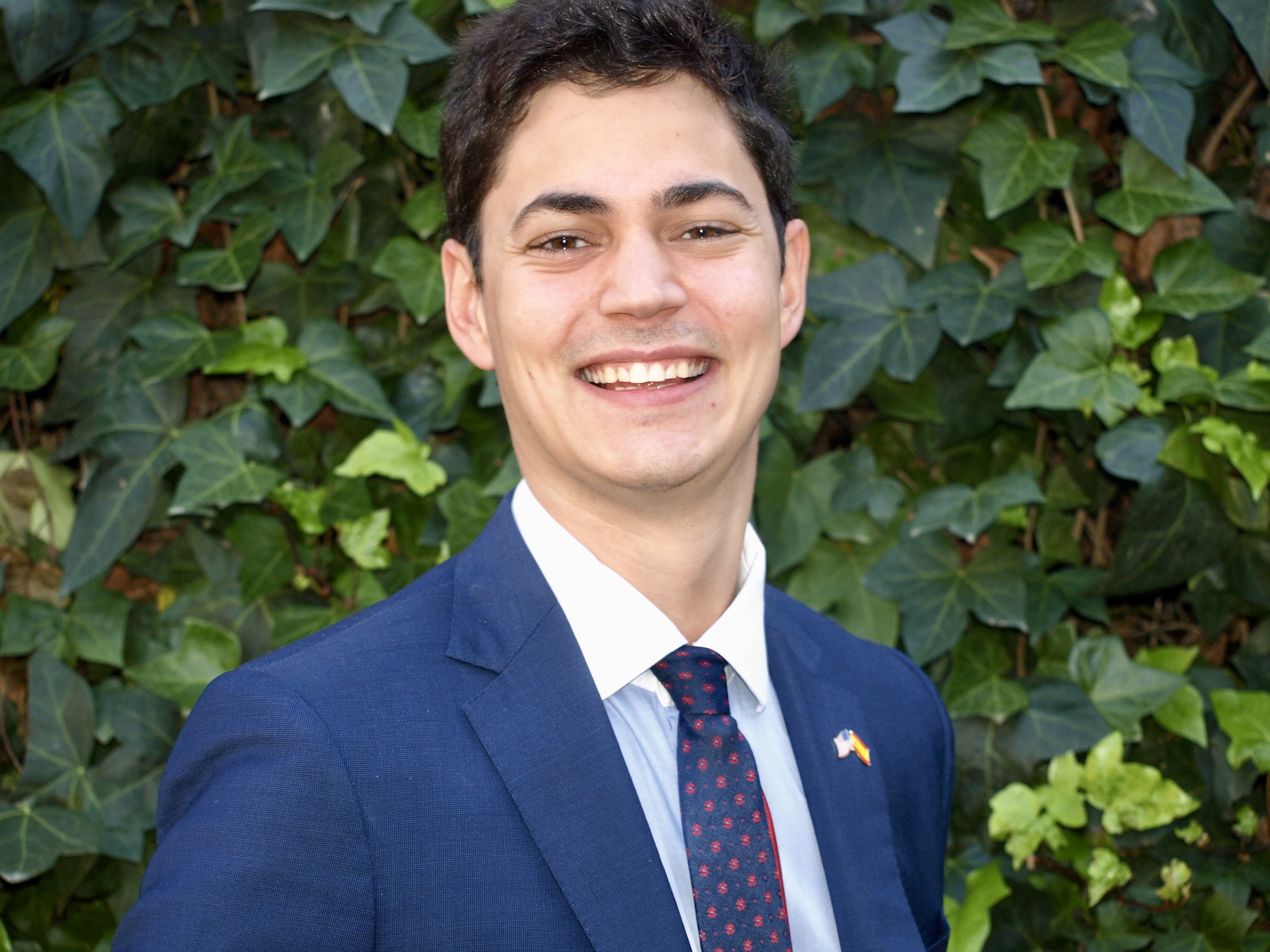 Rafael Gonzalez smiling wearing a suit