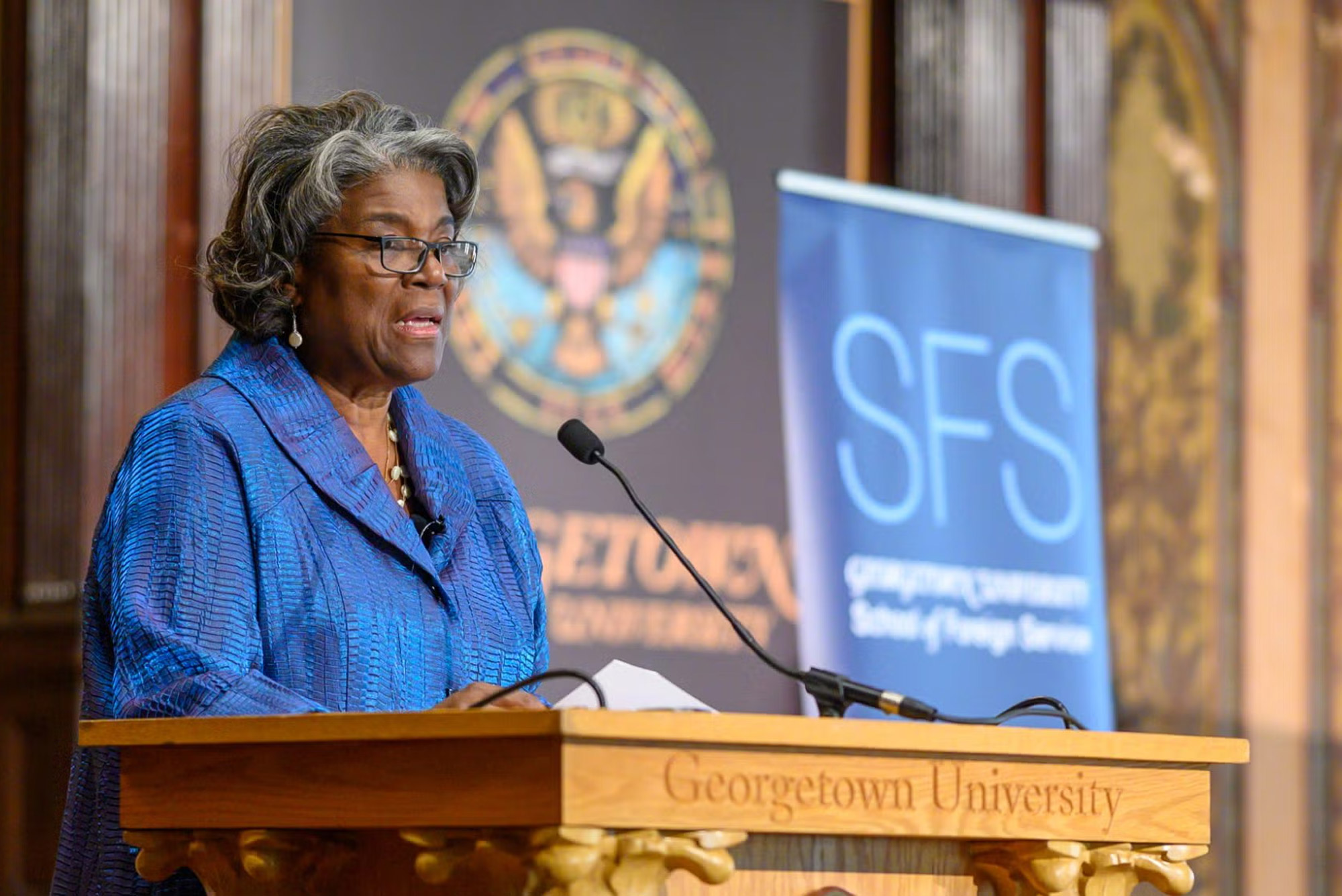 Woman speaking at a Georgetown University podium
