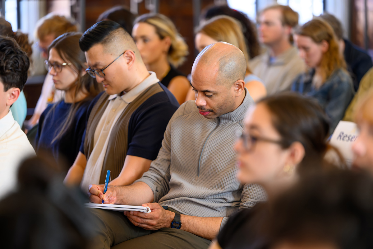 students sitting down taking notes