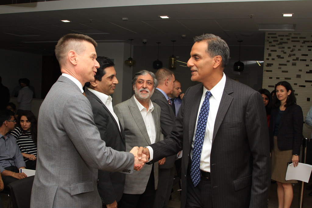 Richard Verma shaking hands.