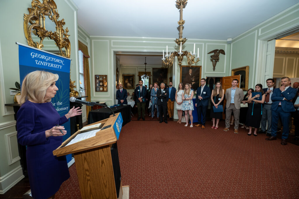 Andrea Mitchell addresses a group of students.